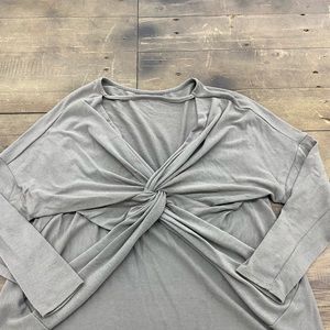 grey sweater with twist in the back